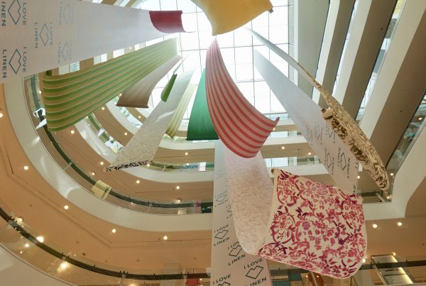 Linen display installation suspended from the top floor in the John Lewis atrium